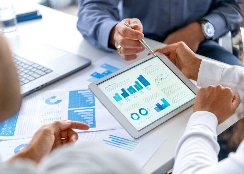 Team discussing financial charts and graphs