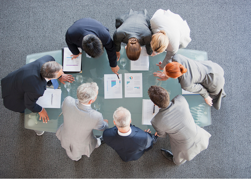 Team analyzing charts together