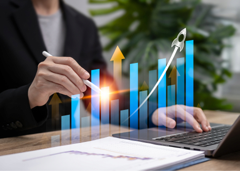 Person analyzing financial data on laptop